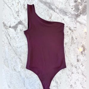Abercrombie & Fitch “Seamless One Shoulder Bodysuit” in color Wine. Size SMALL.